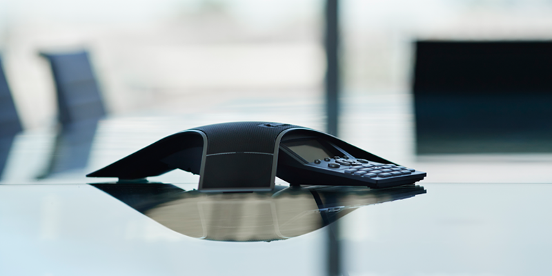 A conferencing phone in an office setting